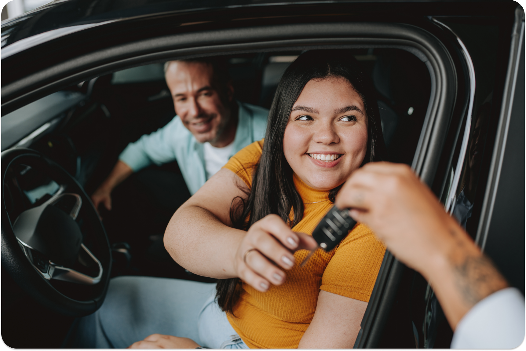 Daughter receiving car keys