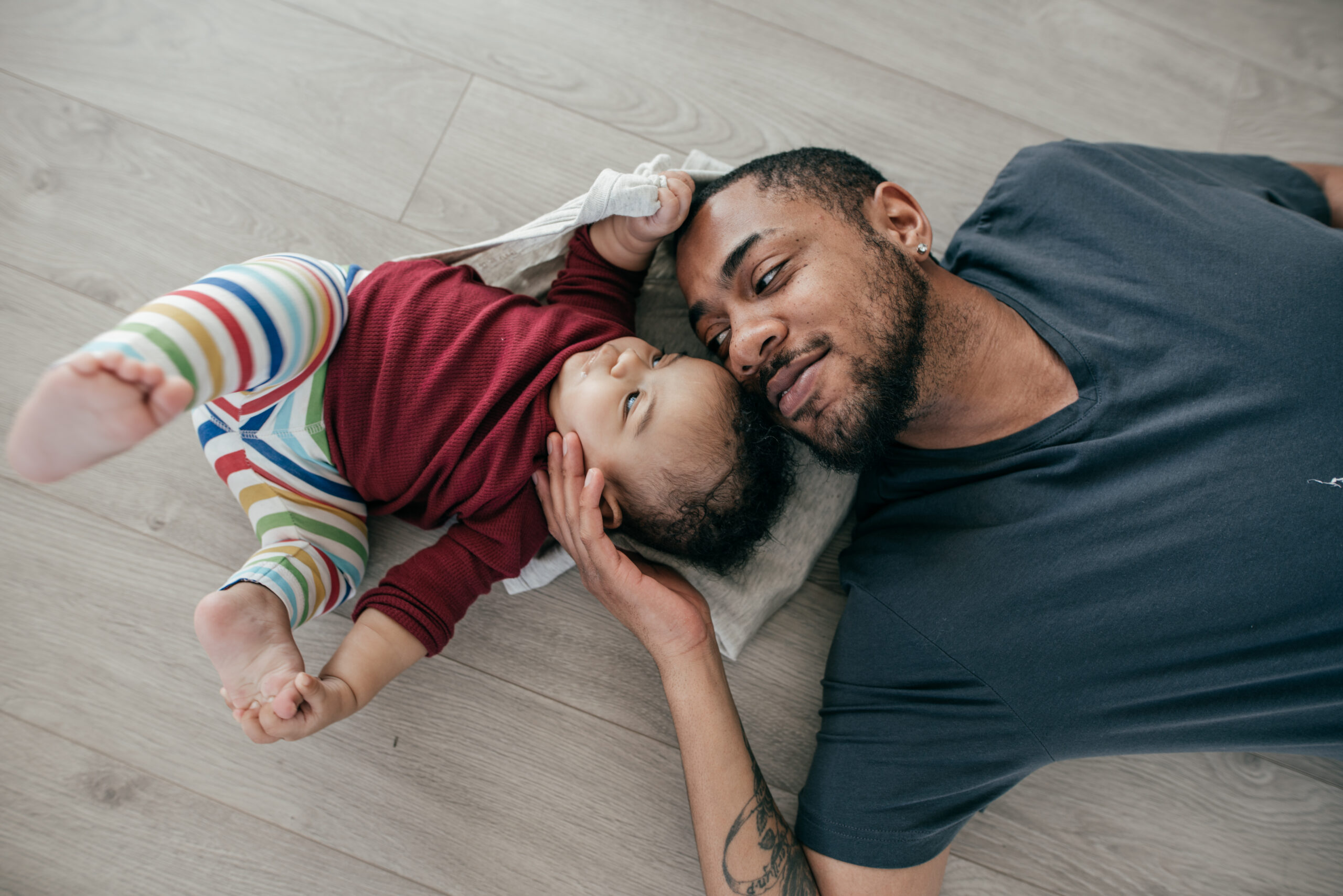 Father and daughter relaxing on the floor